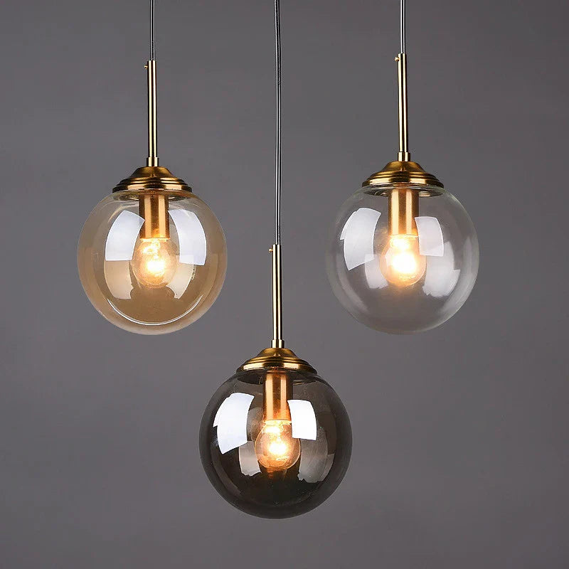 Suspension design luminaire en boule teinté Maison de la Lumière