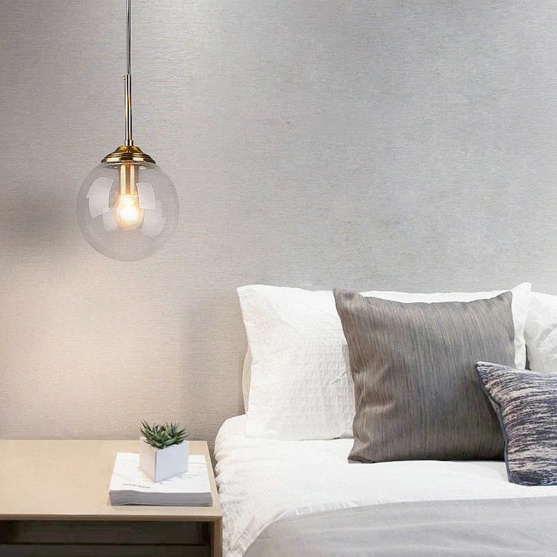 Suspension luminaire design en verre teinté boule Mon Luminaire™